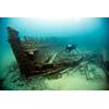 A diver surveys the wreck of Lucinda Van Valkenburg, a wooden three-masted schooner that sank just north of Middle Island in 1887. (Photo: Tane Casserley/NOAA)