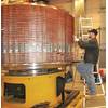 An employee works on the production of a large electrical slip ring at Moog Focal’s Nova Scotia facility.