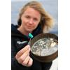 eXXpedition founder Emily Penn studying a sample. © Eleanor Church Lark Rise Pictures