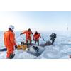 Figure 2. Diver attempting to locate mooring under ice. (Photo credit: Daniel Fatnes of the Norwegian Coast Guard)
