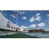 The Flag of the United States of America over the site of the USS Arizona Memorial. The findings underscore the USS Arizona’s dual role as a solemn memorial and a “living laboratory.” (Photo by Brett Seymour, NPS Submerged Resources Center)