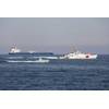 An L3Harris Arabian Fox MAST-13 unmanned surface vessel transits the Strait of Hormuz accompanied by USCGC Charles Moulthrope (WPC 1141) and USCGC John Scheuerman (WPC 1146) on April 19, 2023. (Photo: Vincent Aguirre / U.S. Coast Guard)