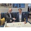 Mark Heine, Fugro CEO, (left) and Auden Berg, EVP, Kongsberg Discovery, sign the agreement at Oceanology International. © Kongsberg Discovery

