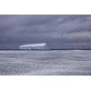 Sea-ice loss exposes glacial ice shelves, which fringe the Antarctic continent, to damaging ocean swells and storms that weaken them, promoting iceberg calving from their front. Photo: Pete Harmsen
