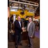 Tyler Schilling (left), president at FMC Technologies Schilling Robotics, and ROVOP managing director, Steven Gray, sign ROV contract at OTC.