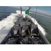 An unmanned rigid-hull inflatable boat operates autonomously during an Office of Naval Research (ONR)-sponsored demonstration of swarmboat technology held at Joint Expeditionary Base Little Creek-Fort Story. During the demonstration four boats, using an ONR-sponsored system called CARACaS (Control Architecture for Robotic Agent Command Sensing), operated autonomously during various scenarios designed to identify, trail or track a target of interest. (U.S. Navy photo by John F. Williams)