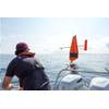 Vehicle assembly and service technician Josh Keller unties Saildrone 1084 from the tow line in Lake Michigan to deploy it for a 2023 U.S. Coast Guard Great Lakes Fisheries survey. (Photo: Saildrone)