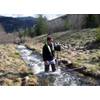 What:	Hydrologist Measuring Streamflow When:	4/11/2014 Where: 	Smelterville, ID, USA  Details:	USGS hydrologist Greg Clark measures streamflow on Government Gulch Creek, a tributarty to the Coeur d’Alene River in northern Idaho. Streamflow data collected are included in the Coeur d’Alene Basin Environmental Monitoring Program the USGS conducts in cooperation with the Environmental Protection Agency.  Credit: U.S. Geological Survey  Department of the Interior/USGS U.S. Geological Survey/photo: De