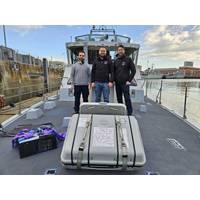 The Aquark team on board the HMS Pursuer. Credit: Aquark