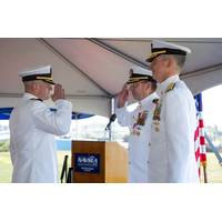 Capt. Kevin J. Behm (left) relieves Capt. Chad F. Hennings as commanding officer of the Naval Undersea Warfare Center Division Newport during a change of command held on Sept. 3, 2025. Rear Adm. Peter D. Small (right), commander of the Naval Undersea and Surface Warfare Centers and chief engineer for the Naval Sea Systems Command, who served as guest speaker during the event. Behm became the warfare center's 72nd commanding officer. (U.S. Navy photo by Dave Stoehr)