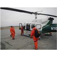 Coast Guard R&D Center researchers board a helicopter as they prepare to evaluate remote Alaskan sites to establish a communications relay network. (U.S. Coast Guard photo by Coast Guard Research & Development Center staff)