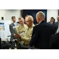Commandant of the Marine Corps, Gen. Robert B. Neller, is briefed on the Advanced Capability Extended Range Mortar (ACERM) during an Office of Naval Research (ONR) awareness day. (U.S. Navy photo by John F. Williams)