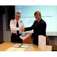 Commodore Guy Robinson from Navy Command Headquarters shaking hands with Geraint West, the NOC’s Director of National Marine Facilities after the signing of the Memorandum of Understanding