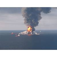 Deepwater Horizon burning in April 2010. Image by US Coast Guard