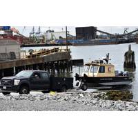 A District vehicle retrieves a survey vessel at the New York District's reconstructed Caven Point Marine Terminal in Jersey City, N.J., June 12, 2018. The new boat ramp enables launching and retrieving craft during all points in the tide cycle. A section of the Hydrogaphic Surveys class was taught aboard survey vessels on the water in New York-New Jersey Harbor. (Photo by James D'Ambrosio)