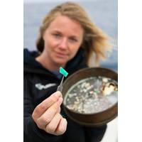 eXXpedition founder Emily Penn studying a sample. © Eleanor Church Lark Rise Pictures