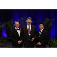 Gilles Lambaré, CGG, (center) and Sheng Xu, Statoil, (right) being jointly presented with the SEG Reginald Fessenden Award by SEG President, John Bradford (left). (Image: SEG)