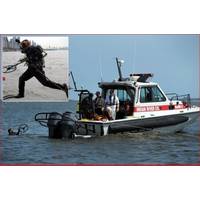 Indian River Fire Rescue diver surfaces holding 16 inch coil after recovering evidence. Inset photo: Randive diver jumps in with Pulse 8X metal detector.