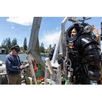 Navy Petty Officer 1st Class Andrew Turner conducts predive checks as Navy Petty Officer 2nd Class Giovanni Casteñeda prepares to test a Deep Sea Expeditionary with No Decompression suit during an exercise at Naval Undersea Warfare Center Division, Keyport, Wash., June 9, 2026. Credit: Scott Pittman, Navy