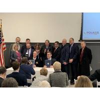 NUWC Division Newport Commanding Officer Capt. Mike Coughlin (seated left) and Polaris Manufacturing Extension Partnership Center Director, Christian Cowan (seated right) signed a Partnership Intermediary Agreement. (Photo by Jeff Prater/Released)