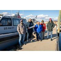 A NUWC Division Newport team assists Bionet Sonar by underwater testing its new wireless technology called HydroNet. From left: Dillon Fournier, manager, Division Newport’s Narragansett Bay Test Facility; Emrecan Demirors, co-founder of Bionet Sonar; Dr. Steve Bordonaro, director, Northeast Tech Bridge; and Bionet Sonar employees, Ryan Burke and Kerem Enhos. (Photo: Dave Stoehr / Navy) 