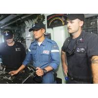 Petty Officer Third Class Higuchi Shoma, Japanese Maritime Self Defense Force (JMSDF), center, pilots USS Pioneer during 2JA 2017 Mine Countermeasures Exercise (2JA-17 MCMEX) as Mineman First Class Zachary Abel, right, observes. 2JA Mine Countermeasures Exercise is an annual bilateral exercise held between the U.S. Navy and JMSDF to strengthen interoperability and increase proficiencies in mine countermeasure operations. (Photo by William McCann)