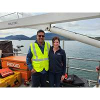 Pictured from left to right: Adrian Maharaj (Pioneer Consulting's shipboard representative) and Sarah Kathrein (CTC Project Manager) aboard the marine route survey vessel for the FISH West and FISH South submarine cable systems at the start of the survey in May 2025. © Cordova Telecom Cooperative, Inc.