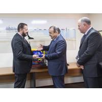 A plaque is presented by Massimo Brebbia, Fugro Subsea MD, to Samir Al Gharbi, GASOS General Manager, with Chris Blake, Director FSME (Photo: Fugro)