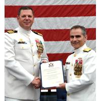 Rear Adm. Brian Brown, commander, Naval Meteorology and Oceanography Command, (right) presents Capt. Van Gurley with a certificate of retirement commemorating 26 years of naval service during a ceremony held July 12 at Stennis Space Center, Miss. (U.S. Navy photo by Jenni Ervin)