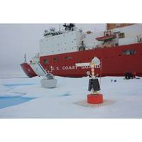 Researchers set up instruments to begin data collection on an ice floe next to USCGC Healy in the Beaufort Sea, Aug. 6, 2023. (Photo: Zane Miagany / U.S. Coast Guard)
