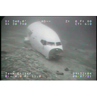 In this image taken July 8, 2021, the forward fuselage of Transair flight 810 is seen as it rests on the ocean floor about 2 miles from Ewa Beach. Rhoades Aviation Inc., dba Transair, flight 810, a Boeing 737-200, ditched in the waters of Mamala Bay near Honolulu, shortly after takeoff from Daniel K. Inouye International Airport, Hawaii, July 2, 2021. (Image: NTSB, courtesy of Sea Engineering, Inc.)
