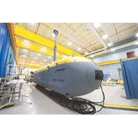 When it comes to the surface, it raises a mast and turns on a diesel generator, charging the lithium ion and silver zinc batteries that power the system while submerged. On the surface, it can communicate via satellite to offload data and download a new operational plan. Even at 50 tons, one operator can control multiple vehicles from anywhere in the world. (Photo: Boeing)