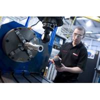 A Wireline employee working on a Roller Bogie Tool