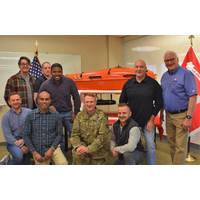 New York District Survey and Mapping Branch employees with New York District Commander Col. Alexander Young and SURVEYOR AMY, an award-winning USV. Left to right, kneeling: John Mraz, Pradeep Bhadur, Col. Young and Joshua Sagona; left to right, standing: Bryan Higgins, Christopher Aballo, Miguel Surage, Survey and Mapping Branch Chief Francis Postiglione and Operations Division Chief Randall Hintz. (Photo: USACE)