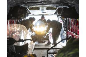 Members of 1 Canadian Ranger Patrol Group and Sergeant Andrew Deutsch of the CH-147F Chinook crew loading a snowmobile to prior to takeoff to the Ski Landing Area (SLA) camp as part of Operation NANOOK-NUNALIVUT in Inuvik NWT. 
Credit: Corporal Jacob Hanlon, Canadian Forces Photo
