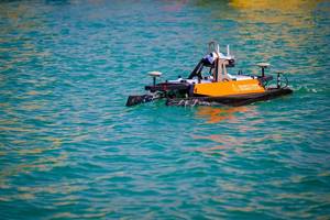 U.S. Naval Oceanographic Office conducts a hydrographic survey by launching an unmanned surface vessel, supported by a Bahrain Coast Guard escort, in the U.S. Central Command area of responsibility. Credit: Official U.S. Navy photo