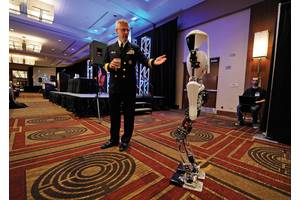 Rear Adm. Matthew L. Klunder, Chief of Naval Research, introduces CHARLI-2 from Virginia Tech’s Robotics & Mechanisms Laboratory during the Office of Naval Research (ONR) 2012 Science and Technology Partnership Conference. U.S. Navy photo by John F. Williams