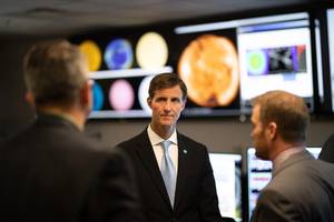 Retired Navy Rear Admiral and Deputy NOAA administrator Tim Gallaudet meets with scientists at NOAA’s National Weather Service Space Weather Prediction Center in 2018 in Boulder, Colorado. Credit: NOAA