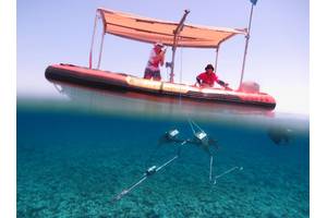 Vessels fitted with a swinging davit arm and winch are ideal for deploying and retrieving Baited Remote Undersea Video (BRUV) systems. In this photo, a Stereo-BRUV system, developed by the Australian Institute of Marine Science (AIMS), is lowered to the seafloor. BRUVs have minimal impact on seafloor communities or the seabed. Photo by Marine Ecology Group - Fish Research, The University of Western Australia