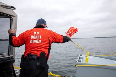 U.S. Coast Guard Boatswain's Mate 2nd Class Tim James, assists with a limited user evaluation of the Naval Undersea Warfare Center Division Newport’s Argus Expeditionary Maritime Defense System at Naval Station Newport’s Pier 2 on May 3, 2022. (Photo: Dave Stoehr / U.S. Navy)