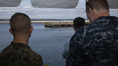 U.S. Military personnel reviewing the SwarmDiver system during the U.S. Navy's Advanced Naval Technology Exercise in August 2018. (Photo: UUV Aquabotix)