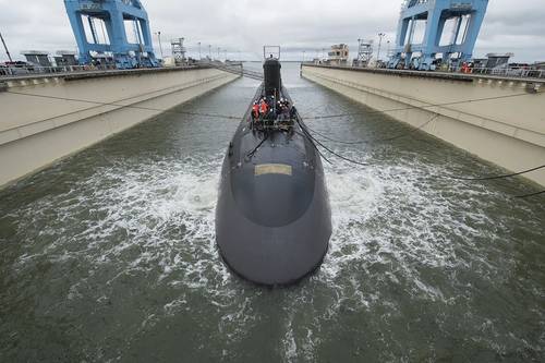The 7,800-ton Virginia-class submarine John Warner was moved with the help of three tugboats to Newport News Shipbuilding’s submarine pier, where final outfitting, testing and crew certification will take place over the next six months. SSN 785 is the first Virginia-class submarine to be named for a person. Photo by Ricky Thompson/HII