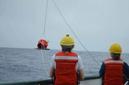 NOAA Affiliates Dr. Elizabeth Steffen (left) and Marine Tech Elizabeth Ricci (right) deploy a Deep Sounding Oceanographic Lagrangian Observer (SOLO) Argo float from the R/V Kaʻimikai-O-Kanaloa in 2018. The Deep SOLO float was developed by the Scripps Institute of Oceanography Instrument Development Group (SIO IDG), and this was the first Deep SOLO float to be deployed by NOAA Affiliates. Credit: NOAA