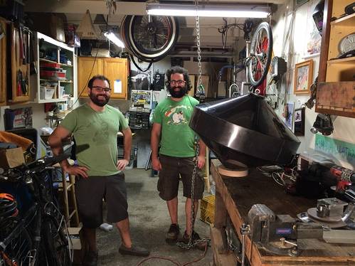 The AquaHarmonics team, Alex Hagmuller and Max Ginsburg, stand with its 1/20th scale device. (Photo: Wave Energy Prize)