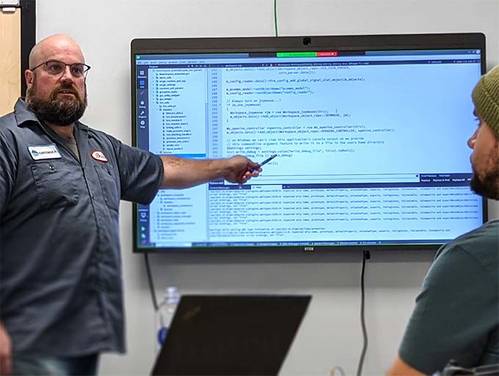 Brian Crist, Engineering Team Lead provides training to new User Interface Team in November (Photo: Greensea)