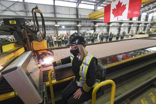 The Canadian Coast Guard’s Heather McDonald cuts the first steel at Seaspan’s Vancouver Shipyard, marking the start of construction of Canada’s most modern science research ship. (Photo: Seaspan Shipyards)