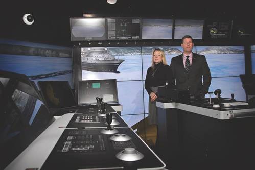 (R-L) Captain Chris Hearn, Director, Center for Marine Simulation and Maria Halfyard, Manager, Applied Research and Industrial Projects  in the Offshore Operations Simulator which is outfitted with a DP system (controller is on the left) (Photo: National Research Council of Canada)