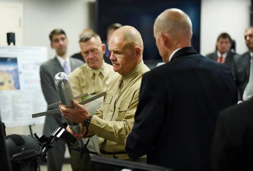 Commandant of the Marine Corps, Gen. Robert B. Neller, is briefed on the Advanced Capability Extended Range Mortar (ACERM) during an Office of Naval Research (ONR) awareness day. (U.S. Navy photo by John F. Williams)