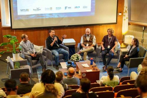 The conference included several panel discussions. From left, Christopher Roman, professor of ocean engineering and oceanography at URI; William Misa, fisheries ecologist at TetraTech; Cameron Thompson, pelagic ecologist at Northeastern Regional Association of Coastal Ocean Observing Systems; URI alumnus Nicholas Chaloux, an engineer at Woods Hole Oceanographic Institution; and URI alumna Emily Shumchenia, ocean data scientist for the Northeast Regional Ocean Council. © URI