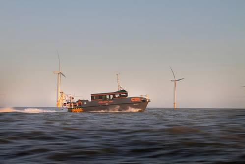 CTruk 20T MPC boat with two wind farm turbines in the background (Photo: CTruk)